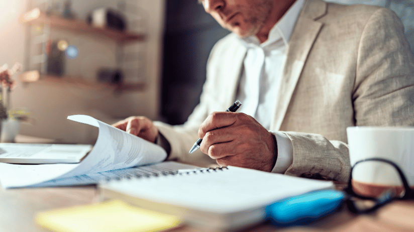 Franchise attorney reviewing documents Franchise attorney reviewing documents