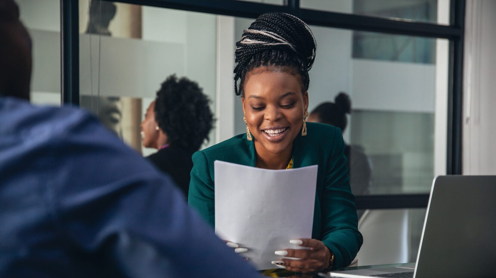 Blog Covers – 2024-05-28T163726.382 (1) African American woman reading a resume at a workshop
