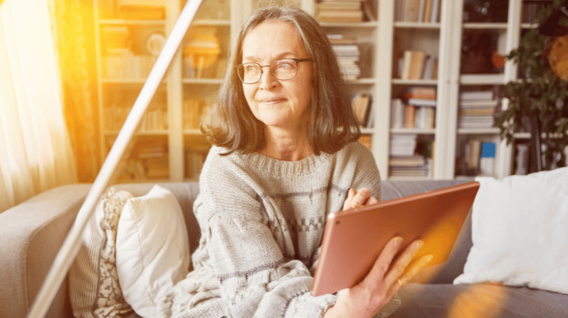 Woman reading about home care franchises