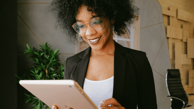 Blog20Covers20-202023-11-01T092143.407 Black female reviewing information on a tablet