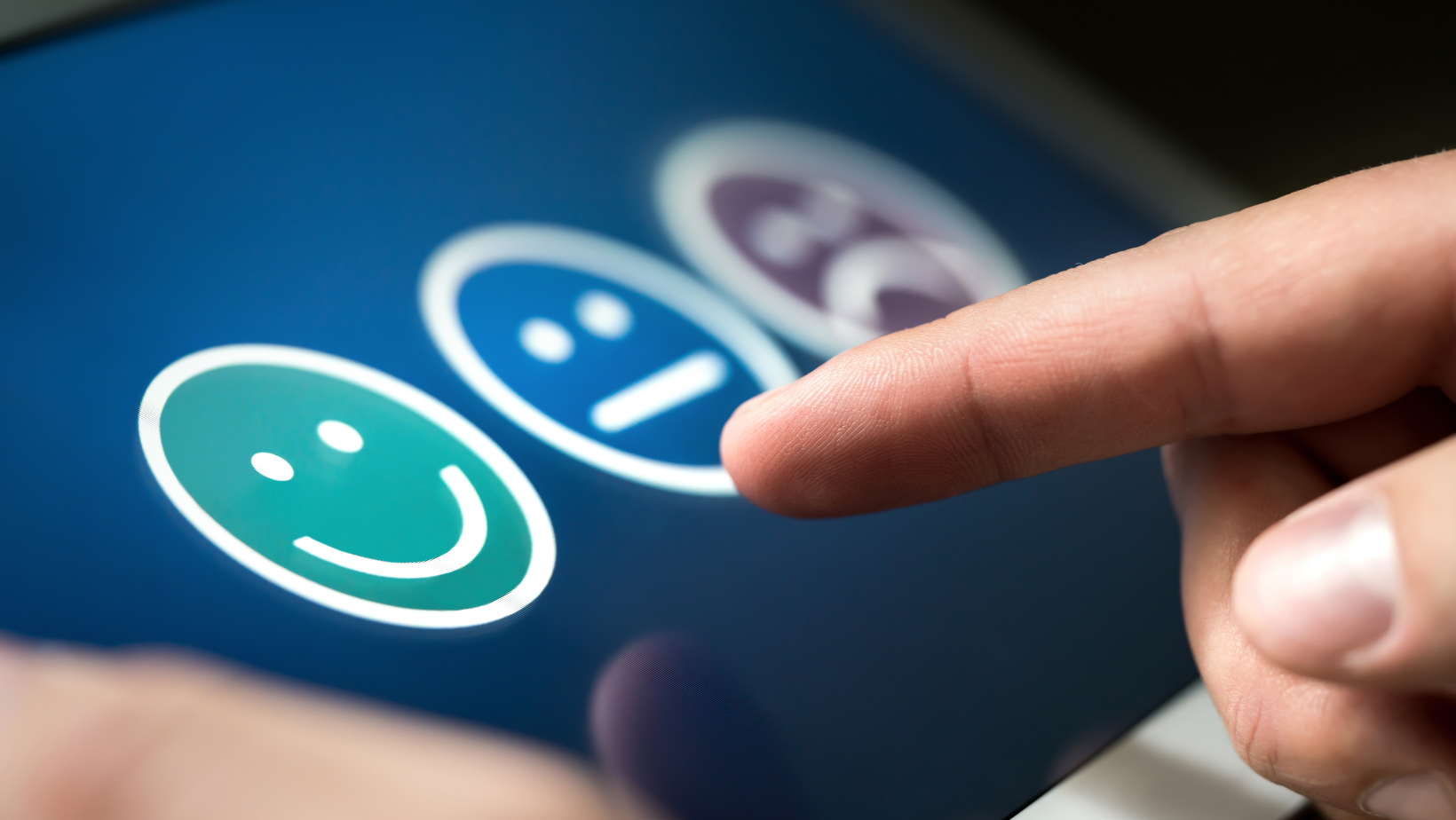 Blog20Covers20285829 Finger pointing to a smiley face on a satisfaction survey