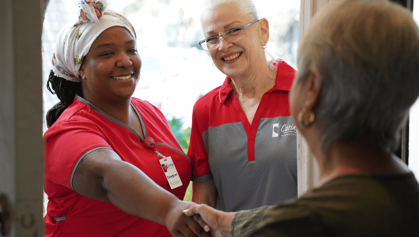 Caring20Spotlight20-202023-09-22T132630.718 Caring Senior Service caregiver and agency director meeting a client