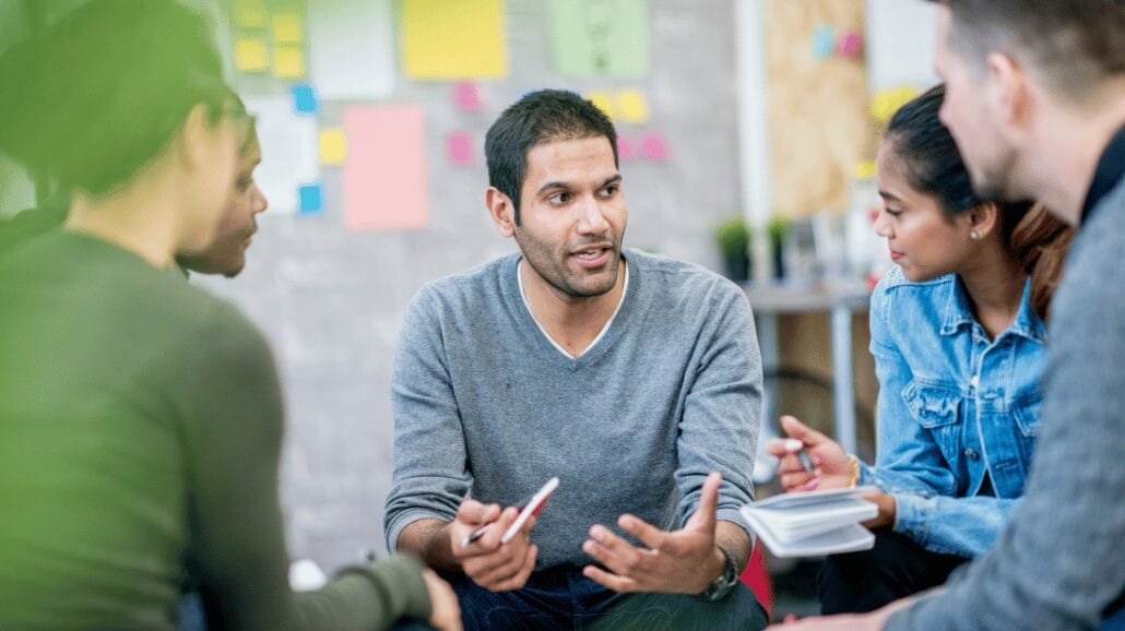 Blog Covers – 2024-09-30T155815.539 Home care team meeting with a bulletin board with sticky notes in the background