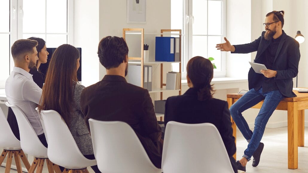 Blog Covers – 2024-10-09T115833.208 Businessman leading a training session in a small conference room