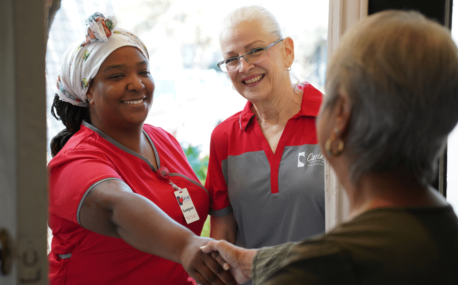 Caring-Senior-Service-1 Caring Senior Service caregiver shaking hands with a client