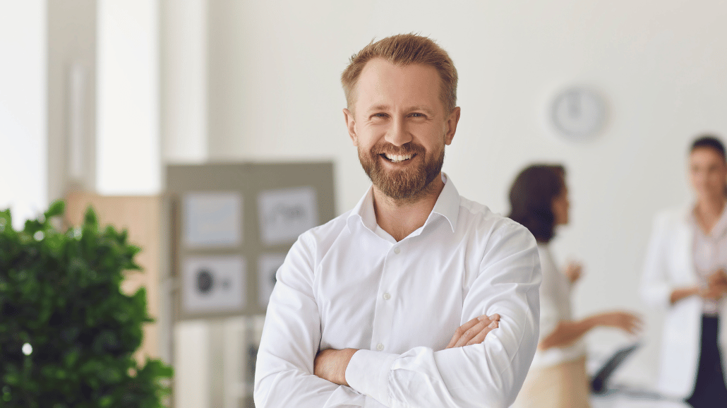 Blog Covers – 2024-11-22T123909.421 Confident smiling business man in a modern office