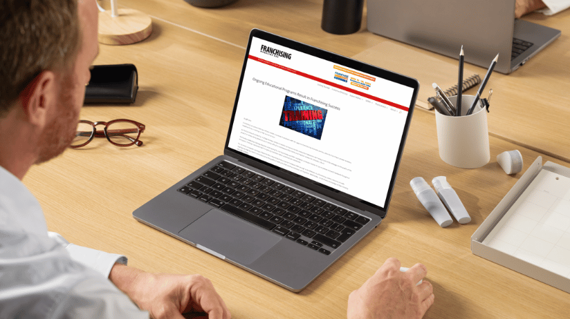 Blog Covers – 2024-12-03T153358.775 Man looking at Franchising Magazine USA article on a computer