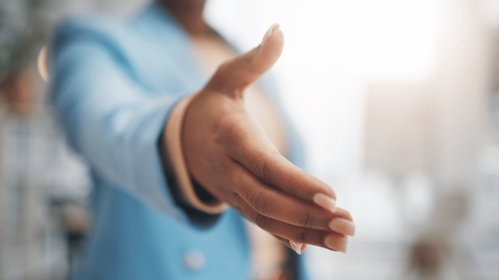 Blog Covers – 2024-12-10T100155.604 Closeup of a female entrepreneur reaching out for a handshake