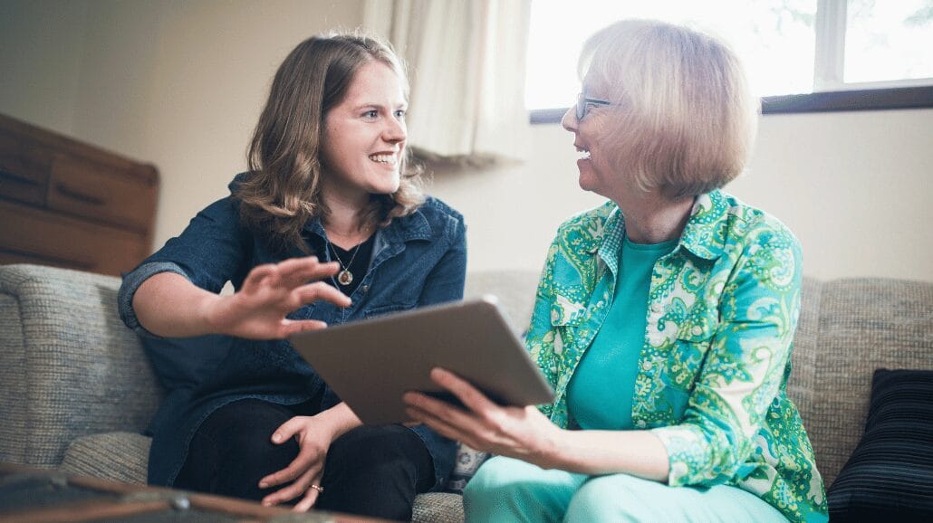 Blog Covers – 2025-05-28T110321.309 Caregiver helping a senior woman with technology