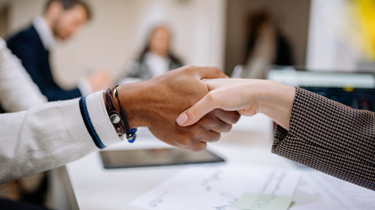 Blog Covers – 2025-10-02T075232.457 Business owners shaking hands at a team meeting