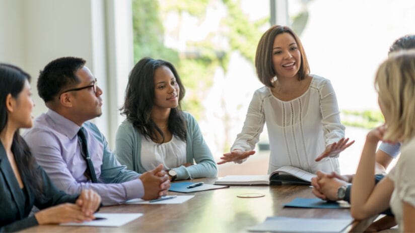 Katy Packingham (1) Business team having a meeting around a table