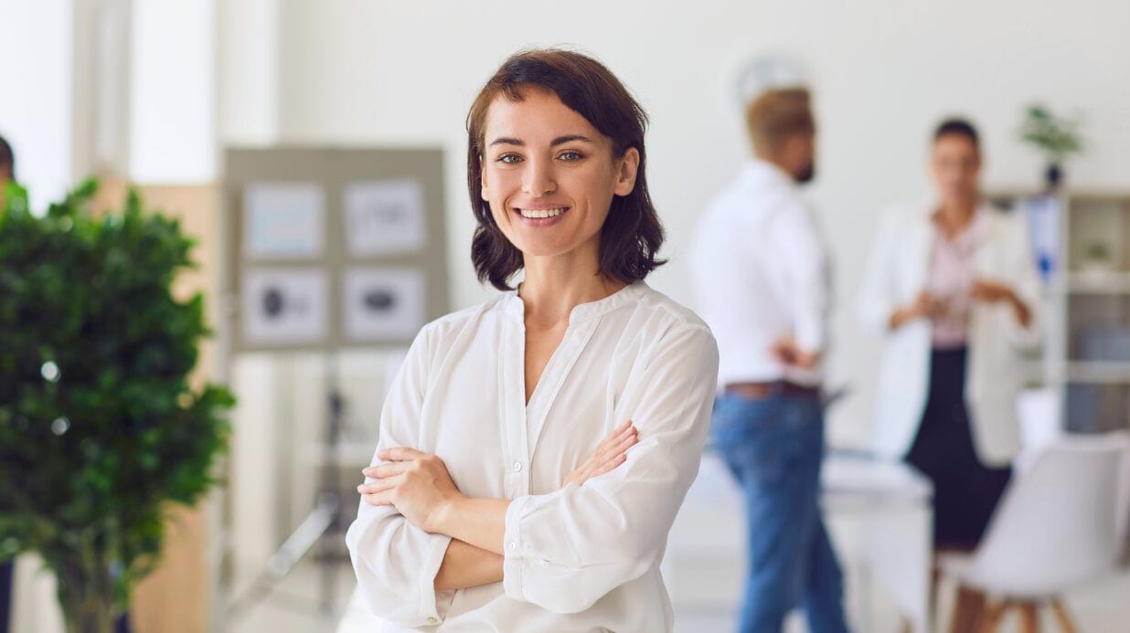 Blog Covers (4) Confident business woman in an open-concept office