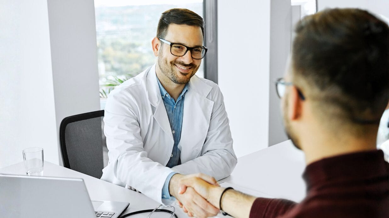 Blog Covers (11) Doctor shaking a hand in his office