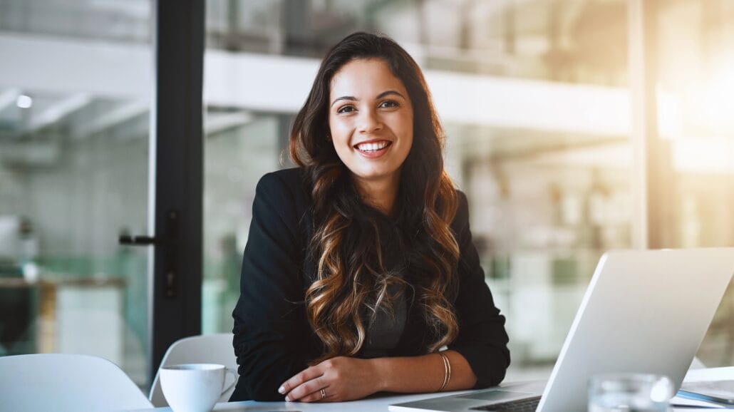 Smiling female entrepreneur in modern office