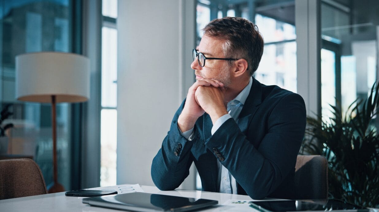 Blog Covers (66) Male executive sitting pensively at his desk